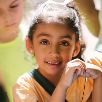 A smiling little girl. Read about Gifts That Protect Your Assets