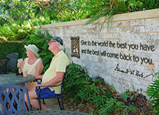 An older couple sitting next to a stone wall. Link to Life Stage Gift Planner Over Age 70 Situations.